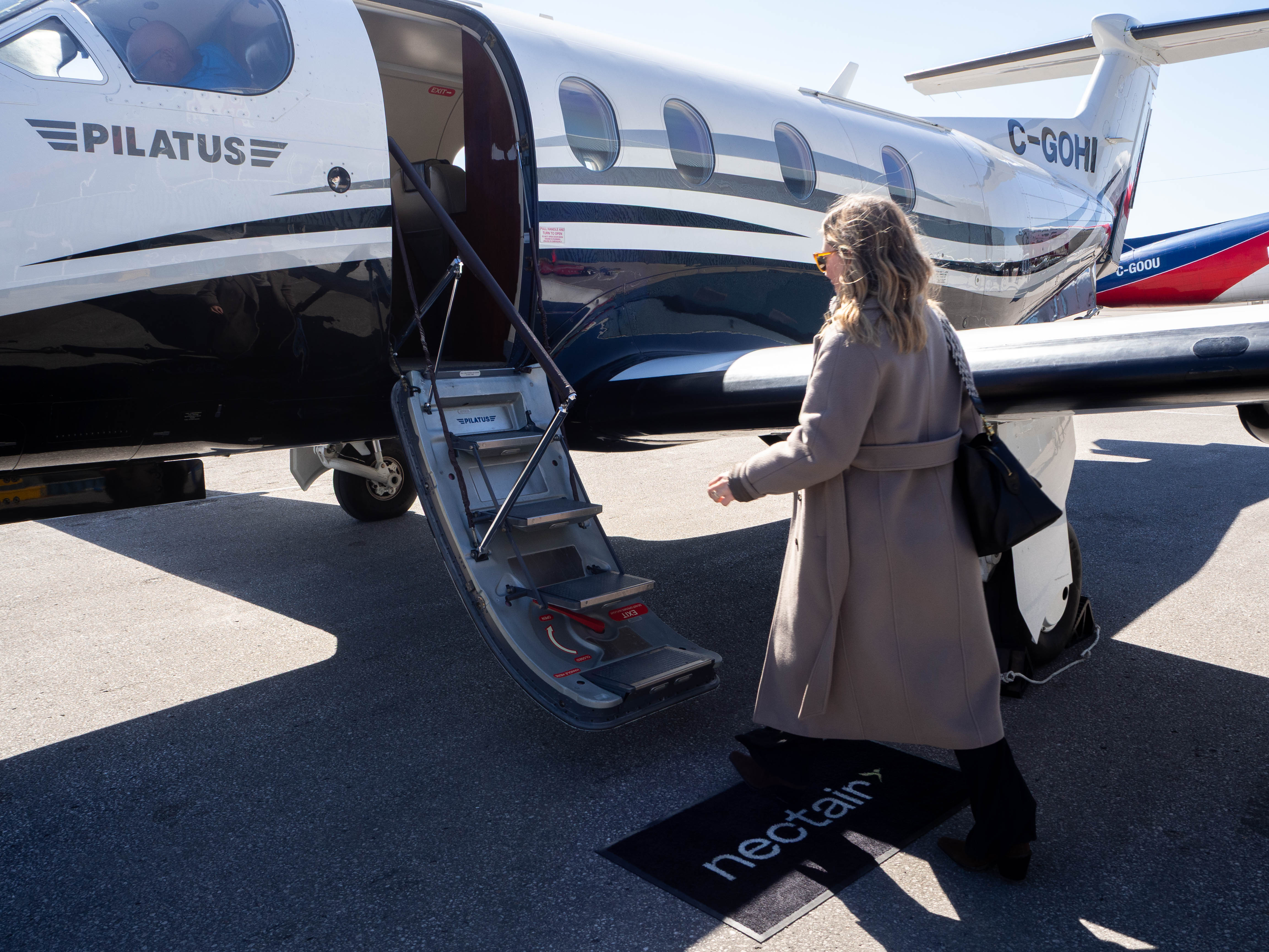 Boarding a NectAir aircraft at a private terminal